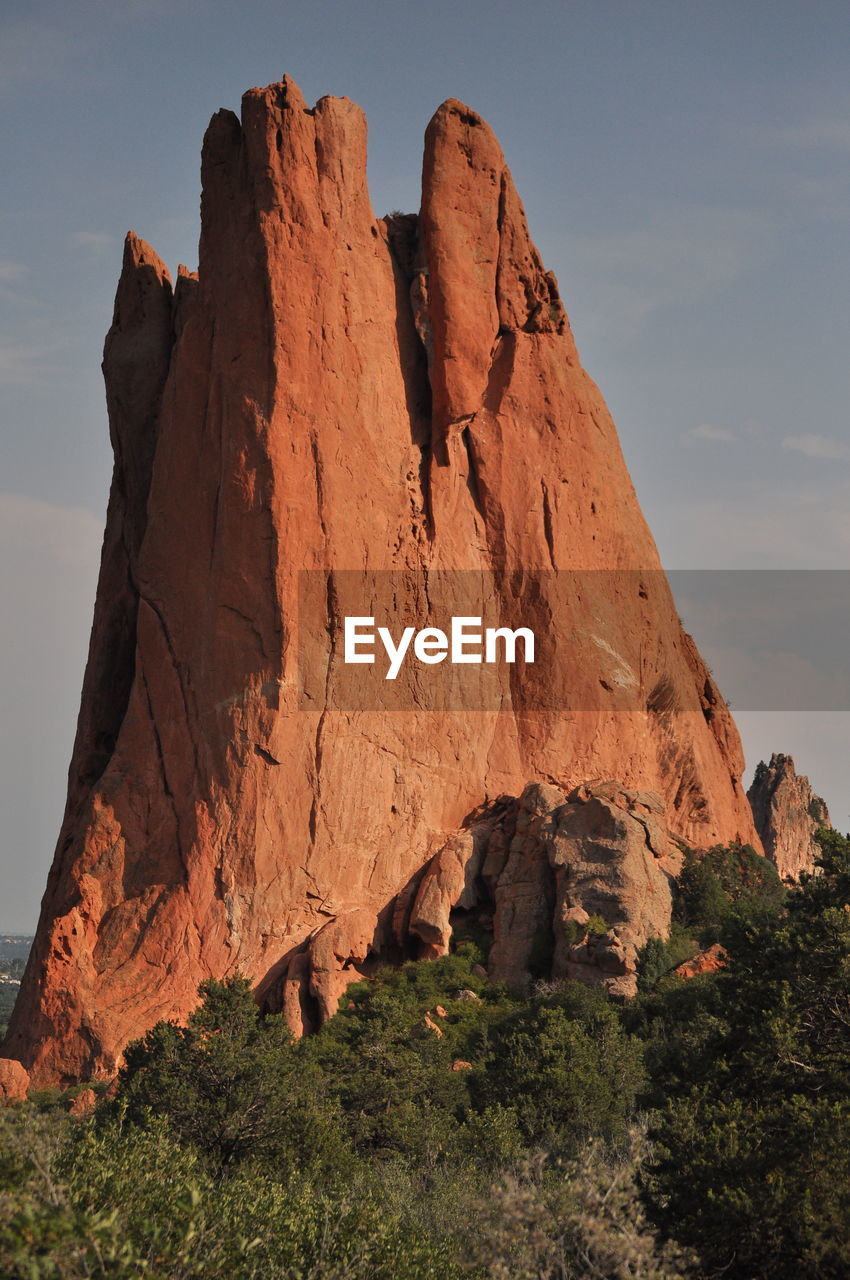 Low angle view of rock formations against sky