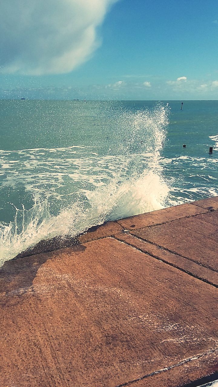 Water splashing on boardwalk