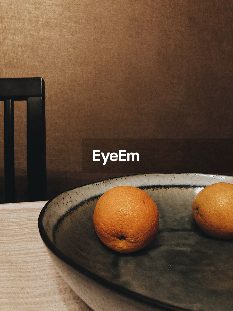 Close-up of orange fruits on table at home