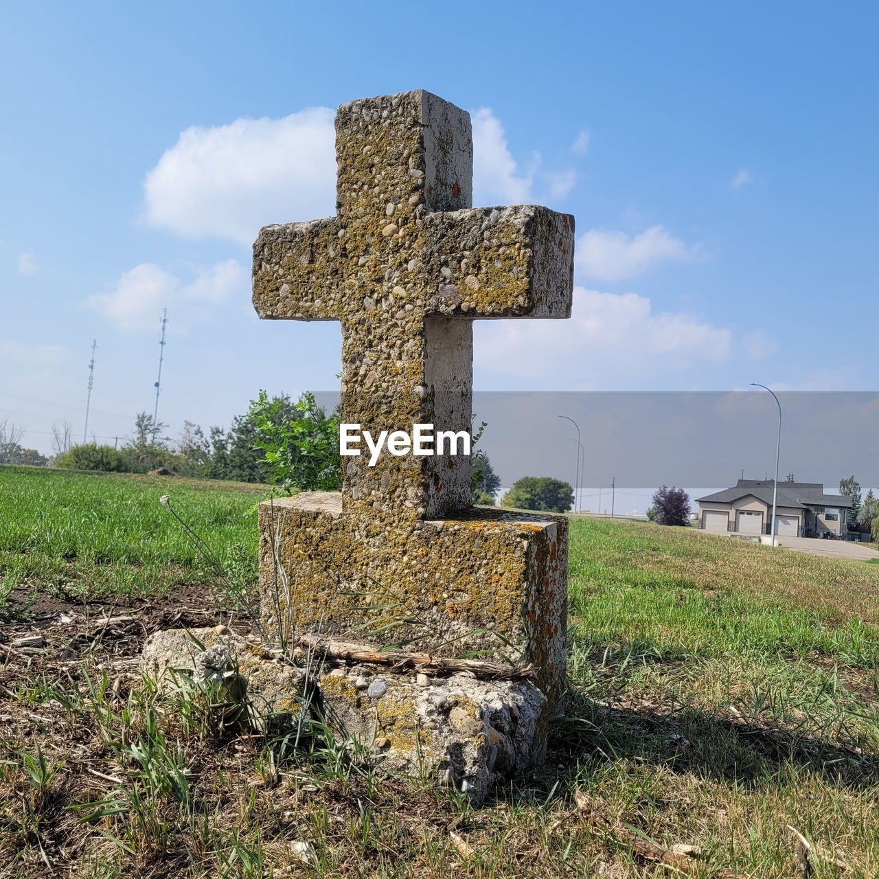 sky, nature, architecture, ruins, day, plant, no people, cloud, history, built structure, outdoors, religion, the past, rural area, wall, water, building exterior, cross, blue, belief, building, stone material