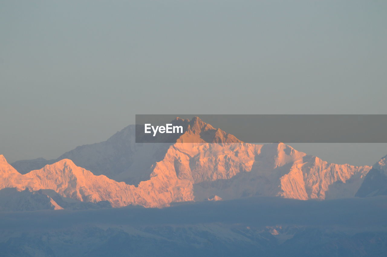 Scenic view of snowcapped mountain against sky