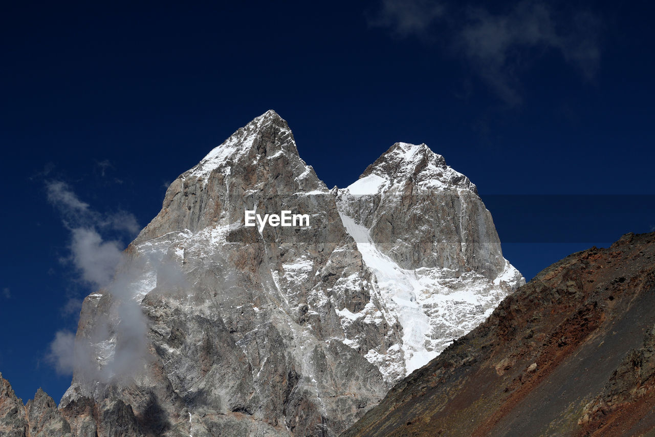 Scenic view of snowcapped mountain against sky