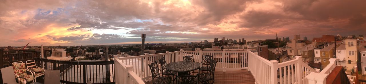 Panoramic view of city against sky during sunset