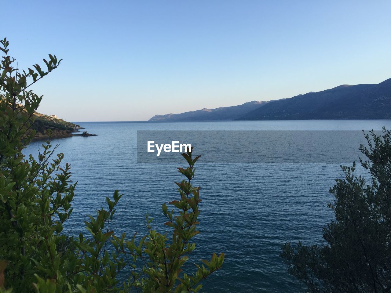 VIEW OF CALM SEA AGAINST CLEAR SKY