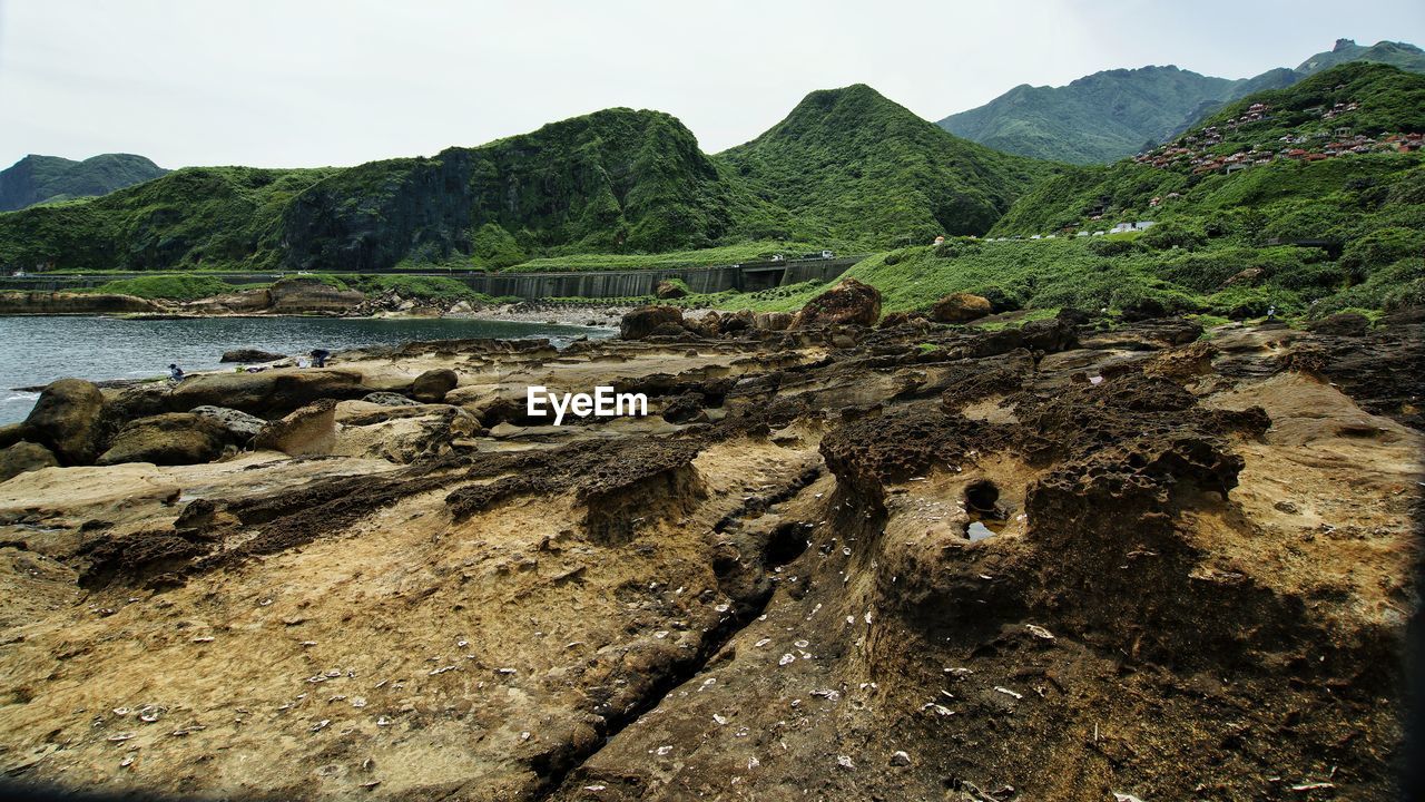 Scenic view of land against sky