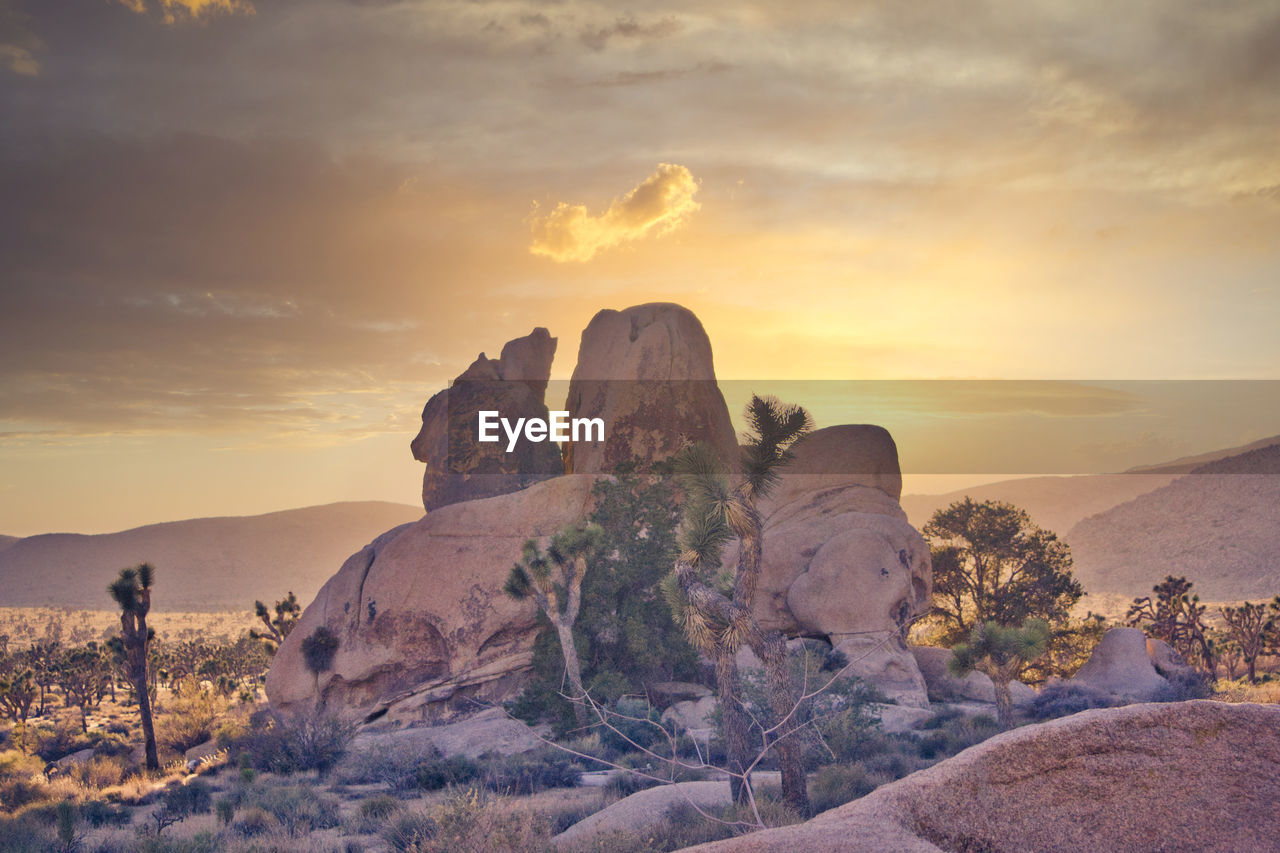 ROCK FORMATION AGAINST SKY DURING SUNSET