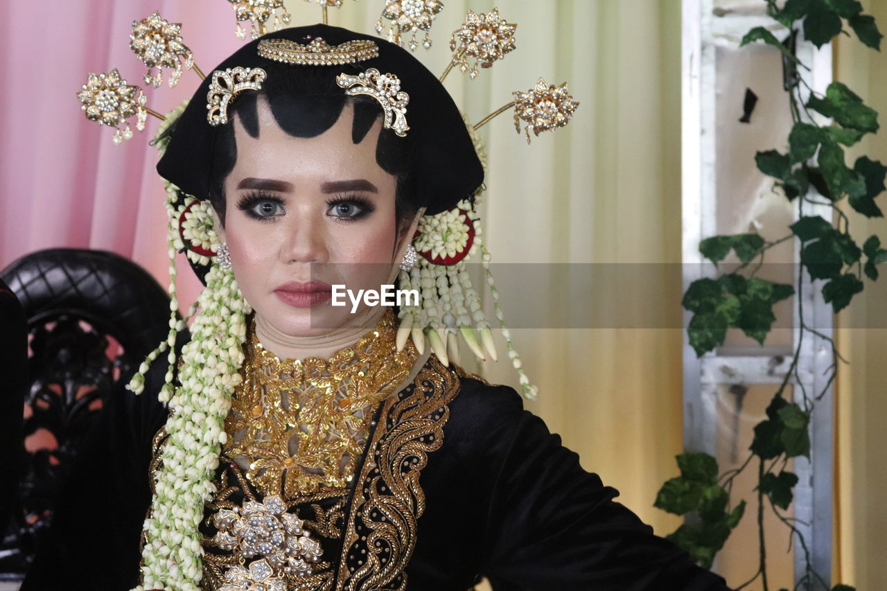 Portrait of young woman wearing traditional clothing