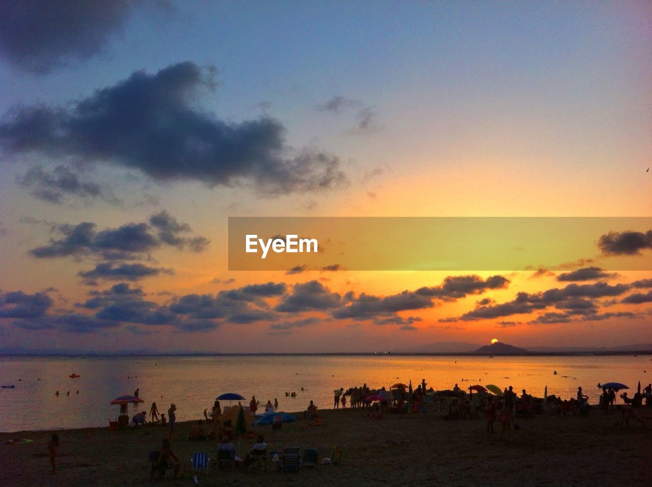 SCENIC VIEW OF SUNSET OVER SEA