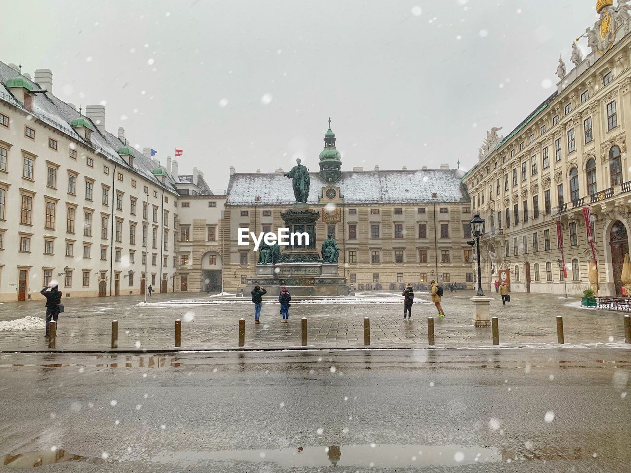 BUILDINGS SEEN THROUGH WET GLASS