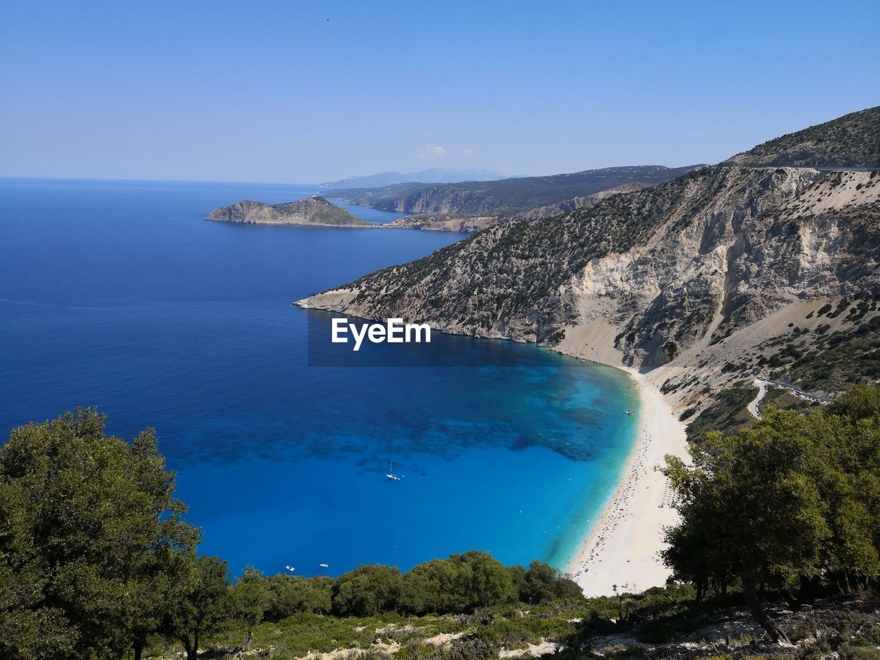 Scenic view of sea against clear blue sky