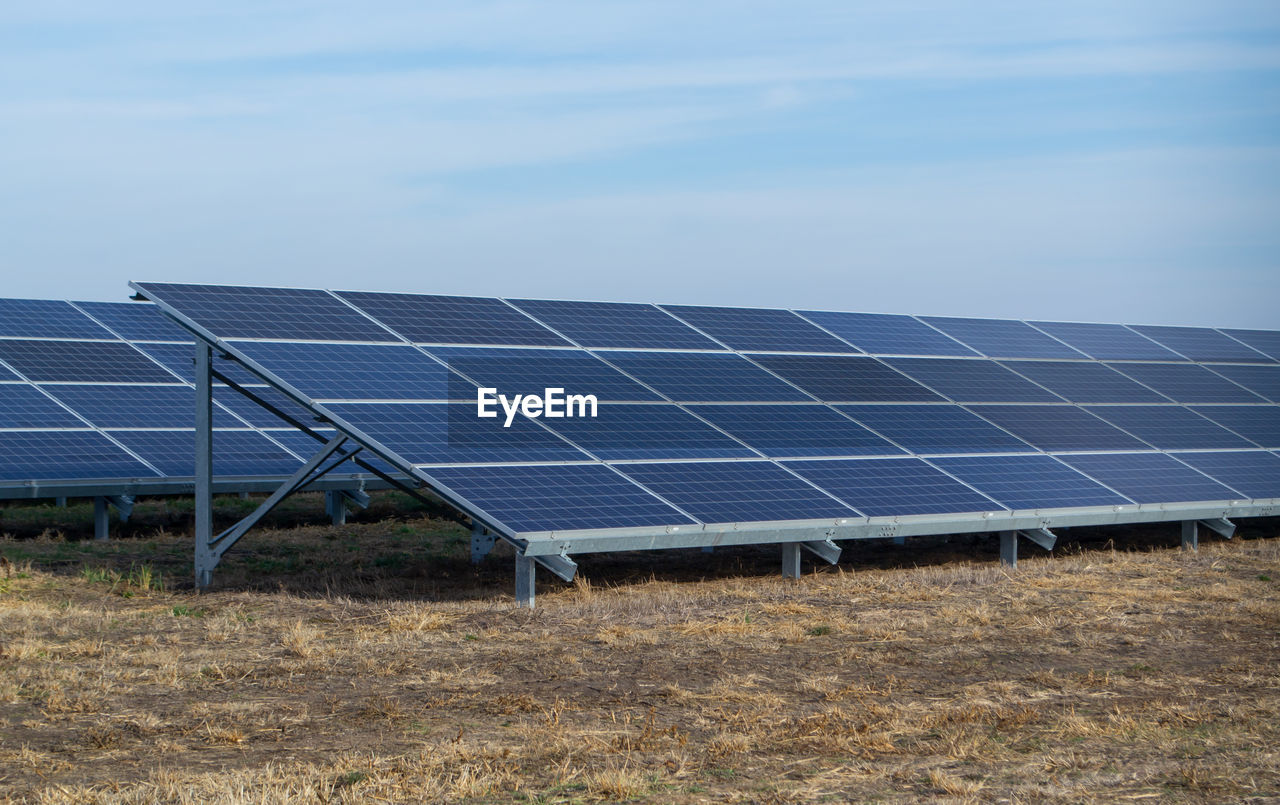 solar panels on field against clear sky