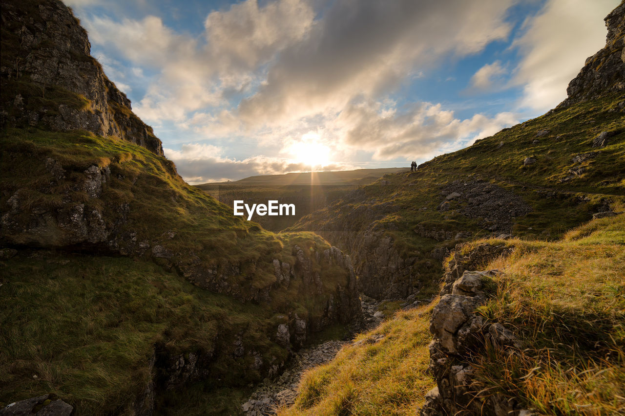 Scenic view of landscape against sky during sunset