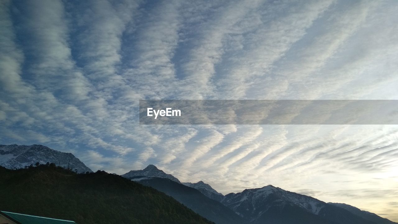 SCENIC VIEW OF MOUNTAINS AGAINST SKY DURING WINTER