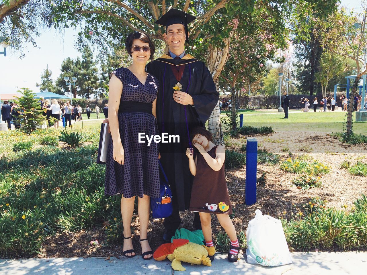Portrait of happy family during graduation