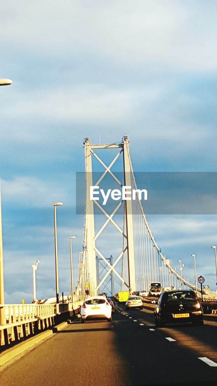 VIEW OF BRIDGE AGAINST CLOUDY SKY