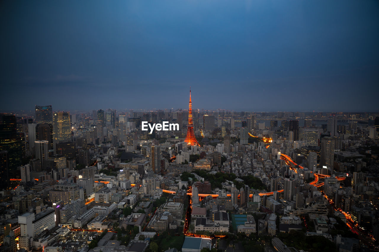 Aerial view of city buildings at dusk