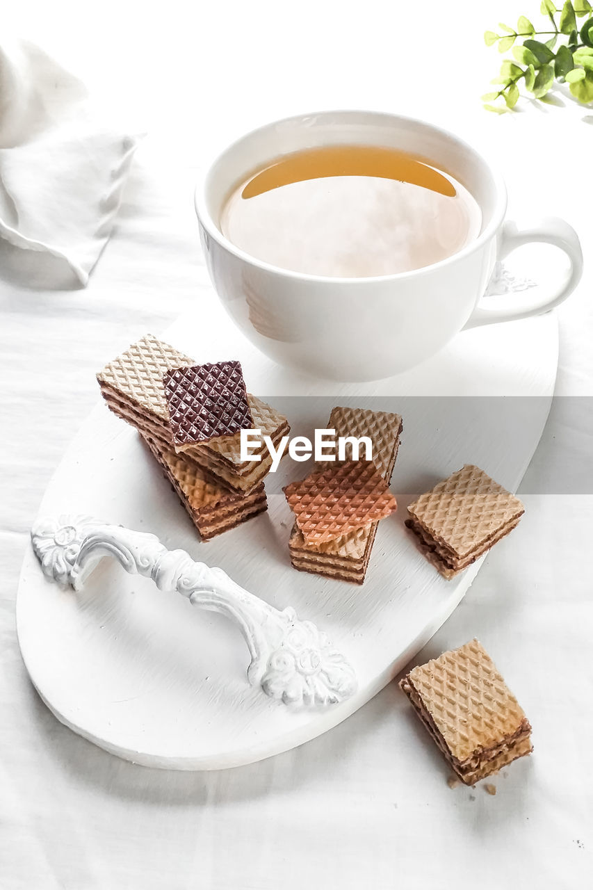 HIGH ANGLE VIEW OF COOKIES AND COFFEE SERVED ON TABLE