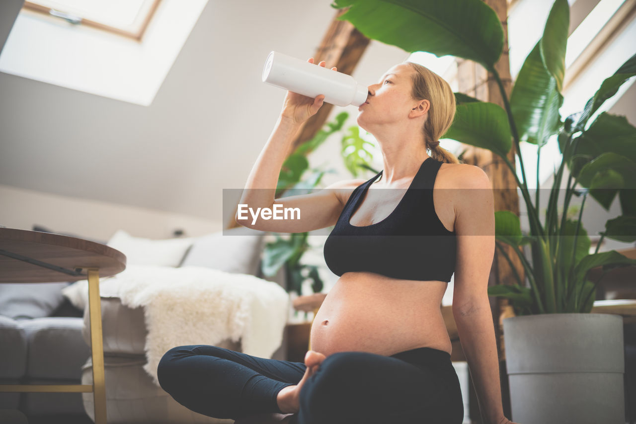 portrait of young woman exercising at home