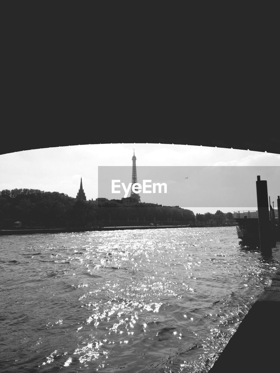 Eiffel tower seen from under bridge