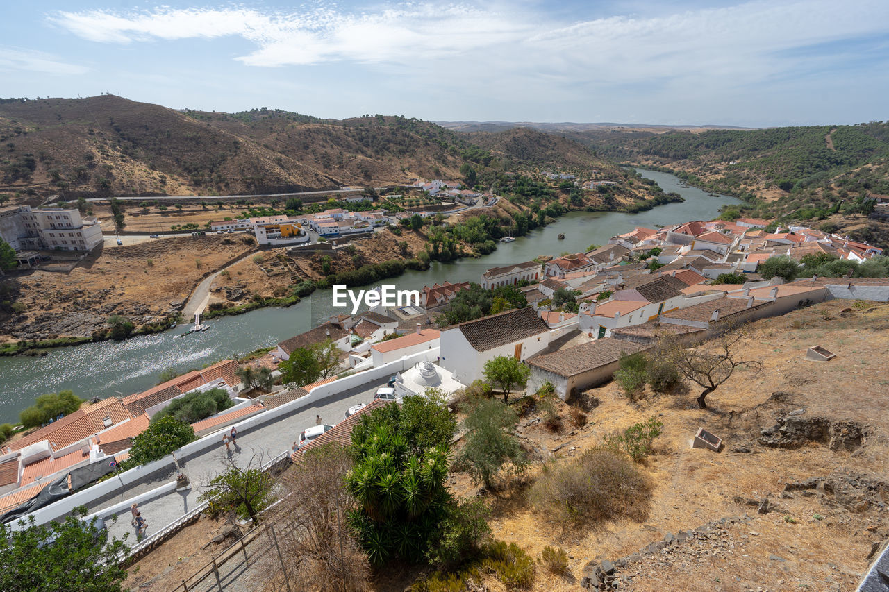 View of the alentejo town of mértola with the guadiana river in evidence.