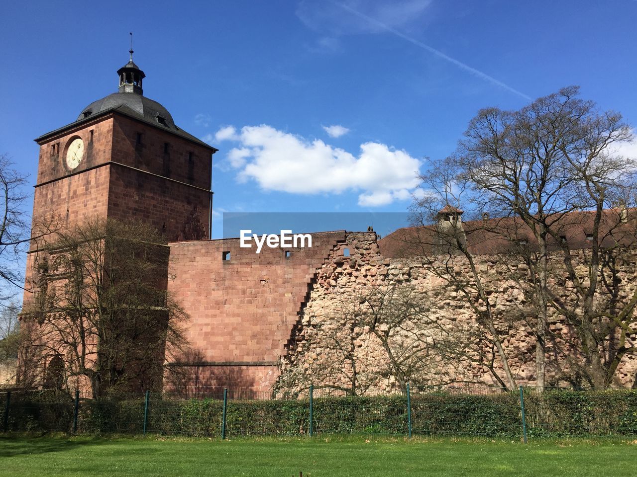 STONE WALL OF BUILDING AGAINST SKY