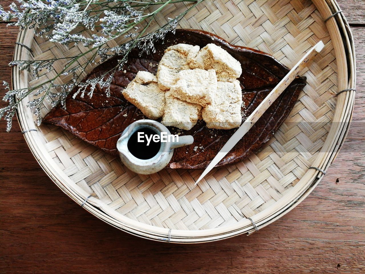 Warabi mochi in retro plate on the classic wooden table. japanese's dessert style.