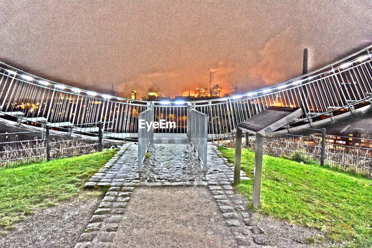 EMPTY WALKWAY LEADING TO BUILT STRUCTURE