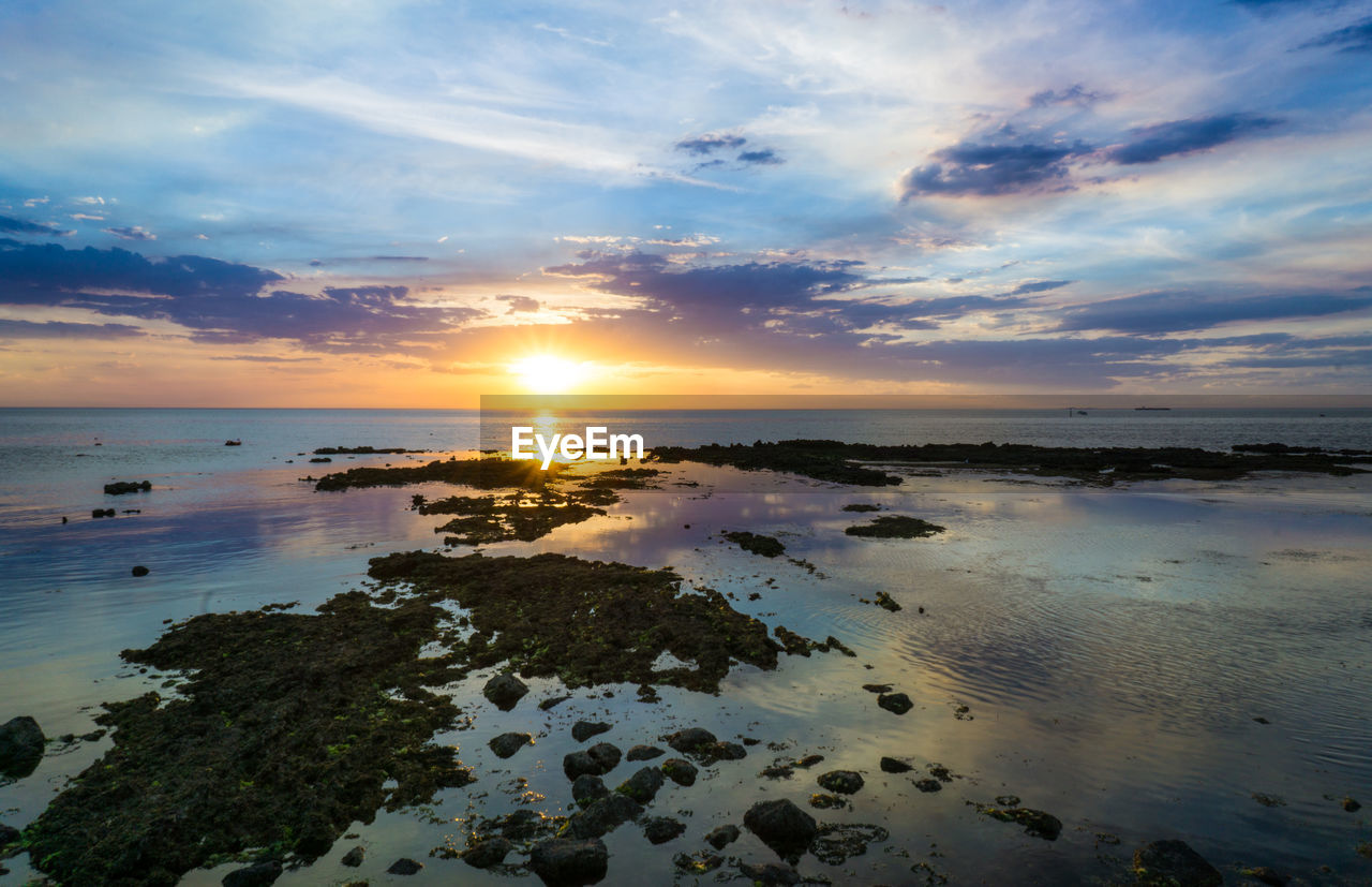 Idyllic shot of sea against sky during sunset