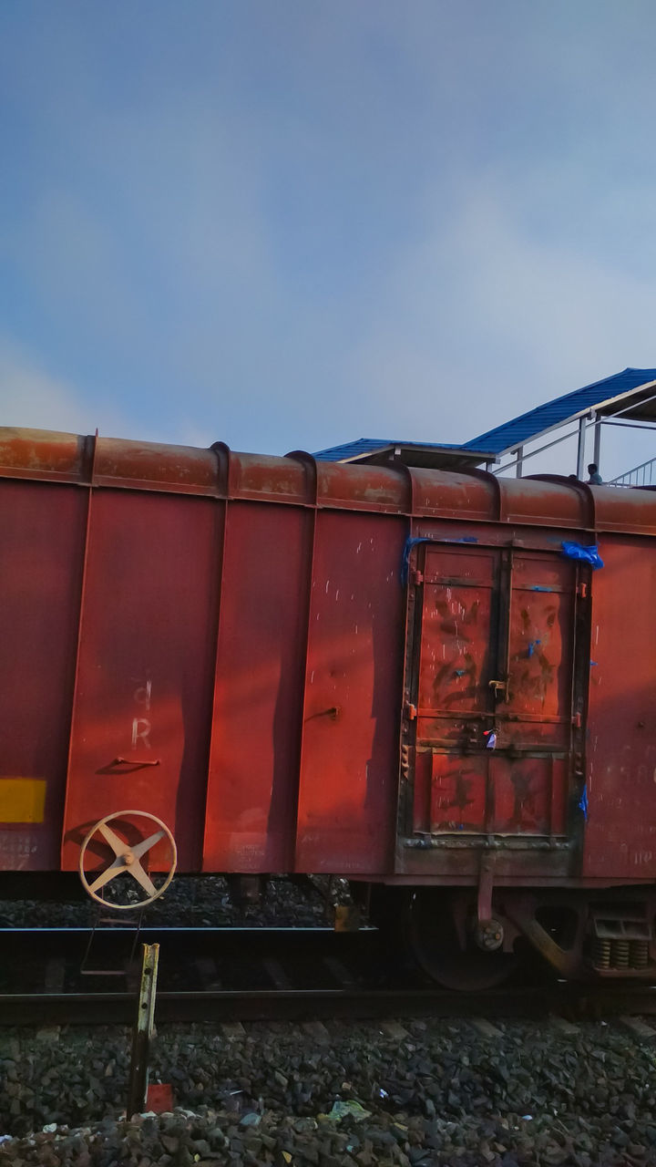 Train on railroad track against sky