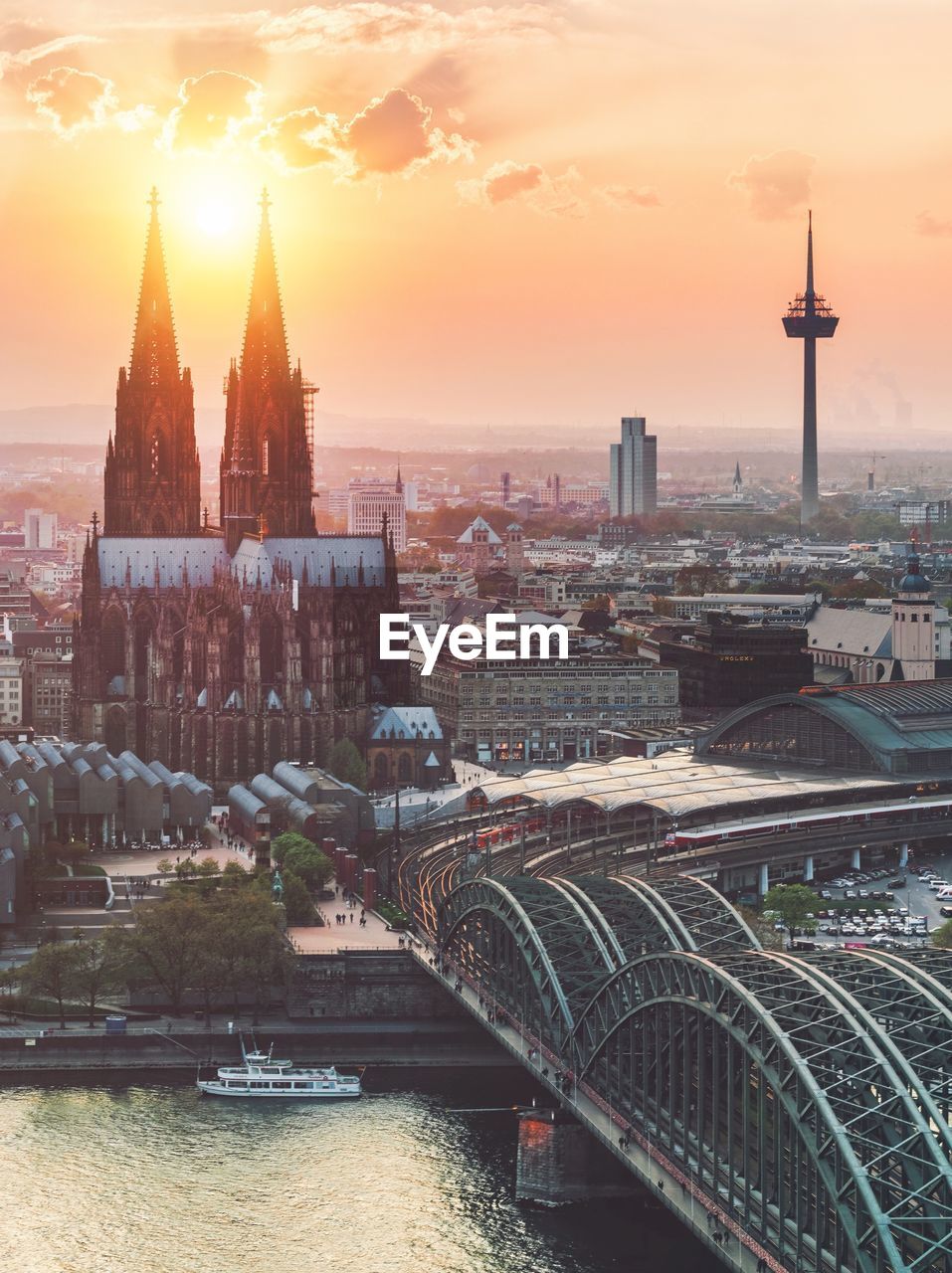 High angle view of buildings in city during sunset