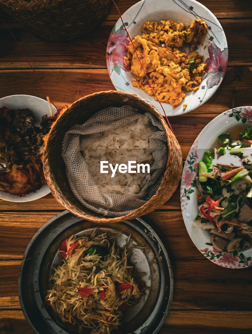 food and drink, food, healthy eating, wellbeing, bowl, freshness, vegetable, directly above, table, asian food, high angle view, no people, spice, indoors, dish, meal, wood, plate, still life, ingredient, variation, meat, rice - food staple, chinese food, crockery, cuisine, pepper
