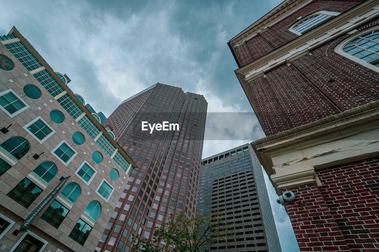 Low angle view of modern buildings against sky in city