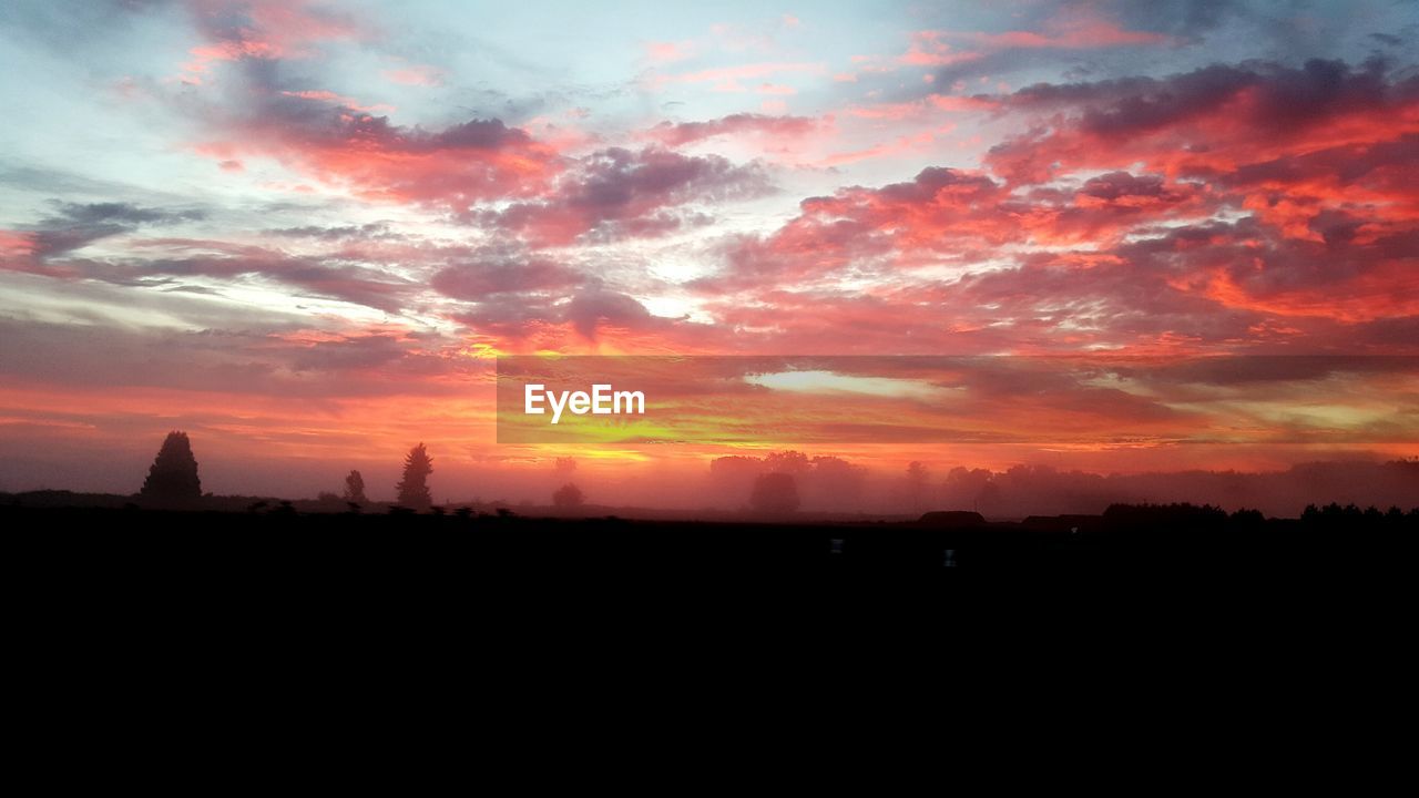 SILHOUETTE OF LANDSCAPE AT SUNSET