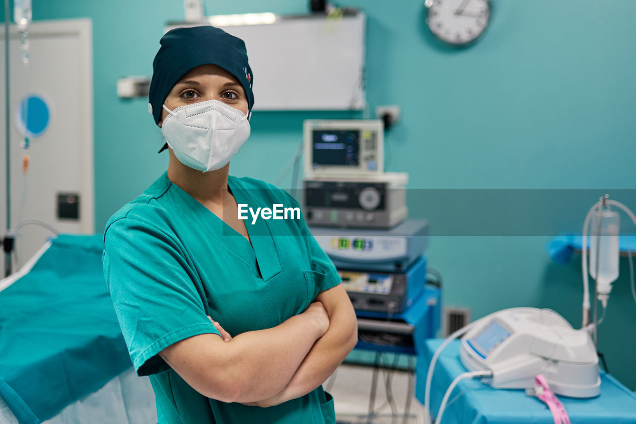 Portrait of surgeon wearing mask in clinic