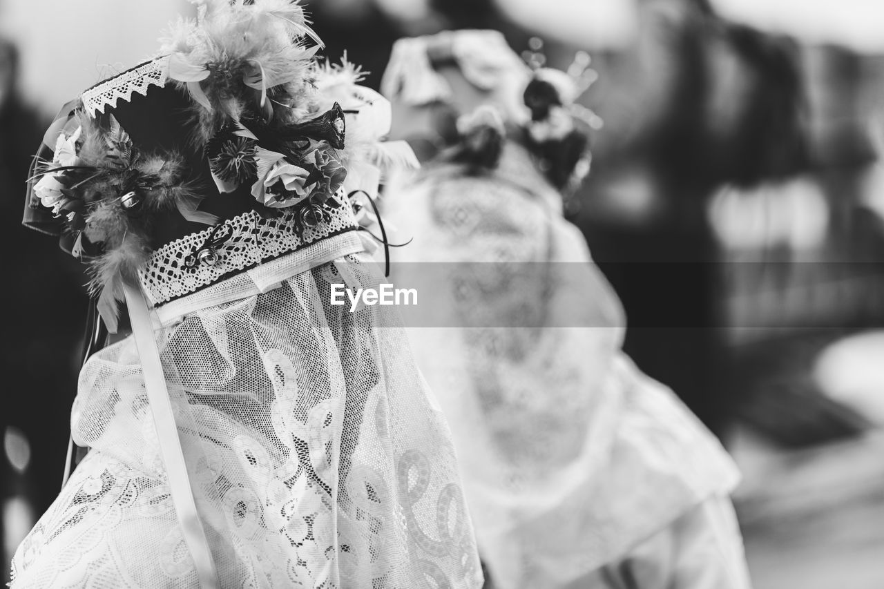 Ancient carnival of sauris. traditional wooden masks. black and white. italy