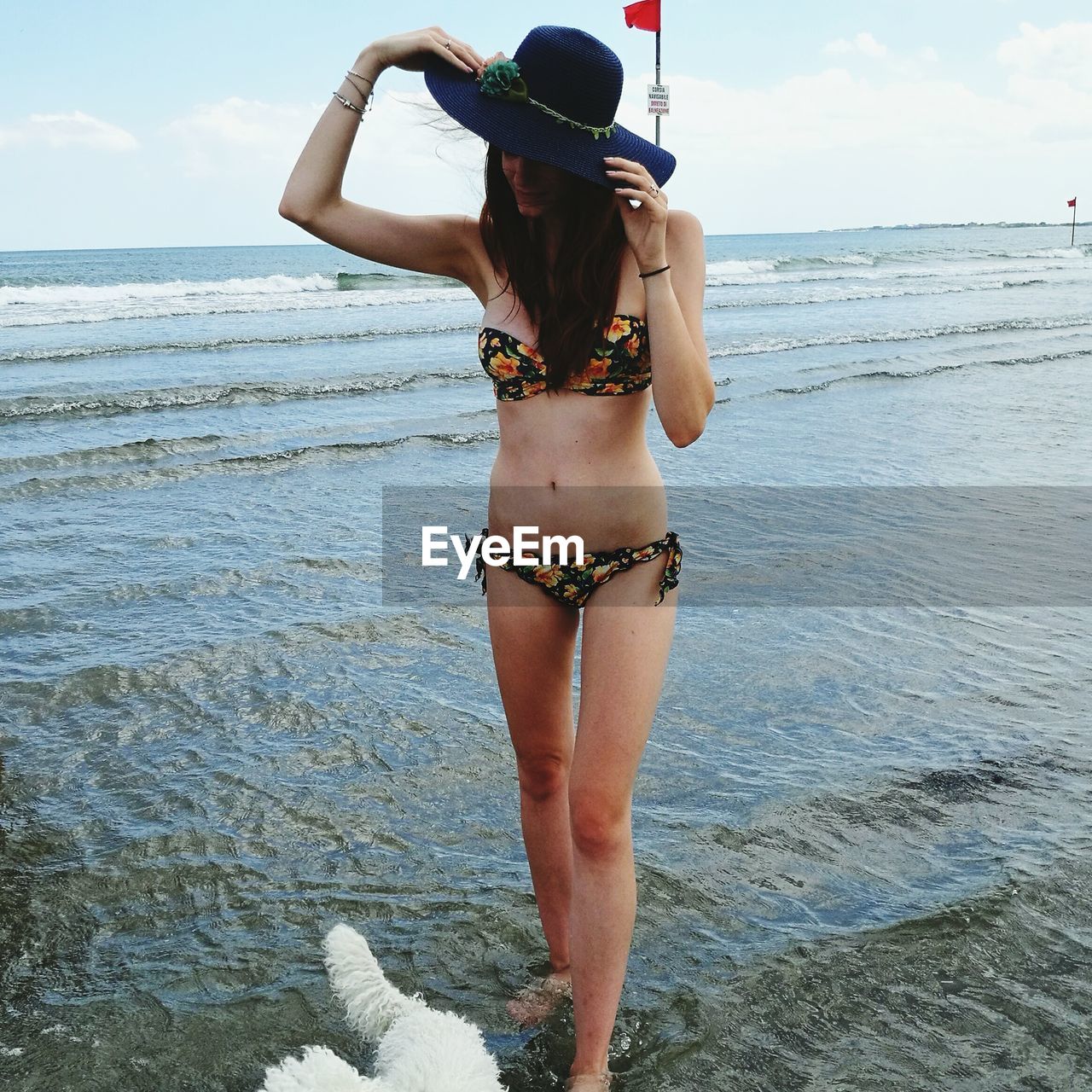 View of woman standing on beach