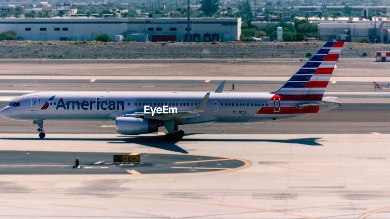 AIRPLANE ON RUNWAY AT AIRPORT