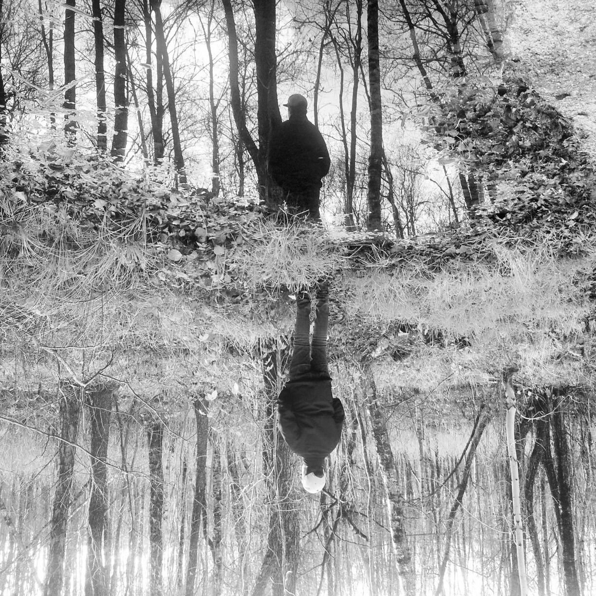 Reflection of man in water