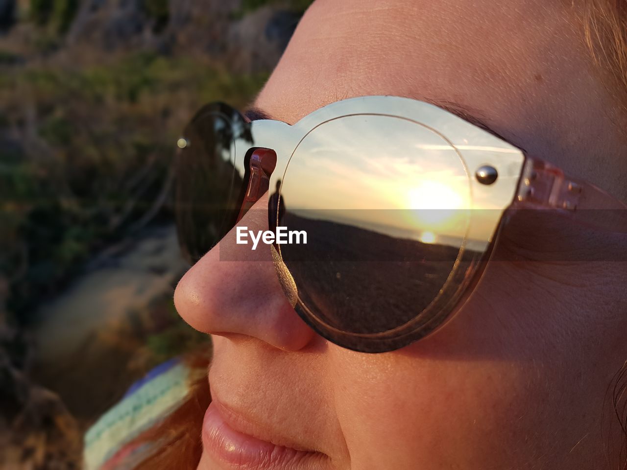 Close-up of woman wearing sunglasses