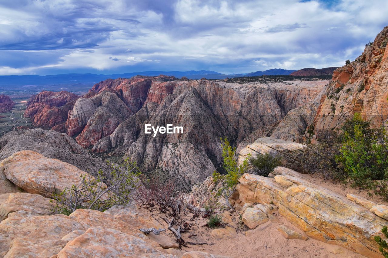 Rock formations on landscape against sky