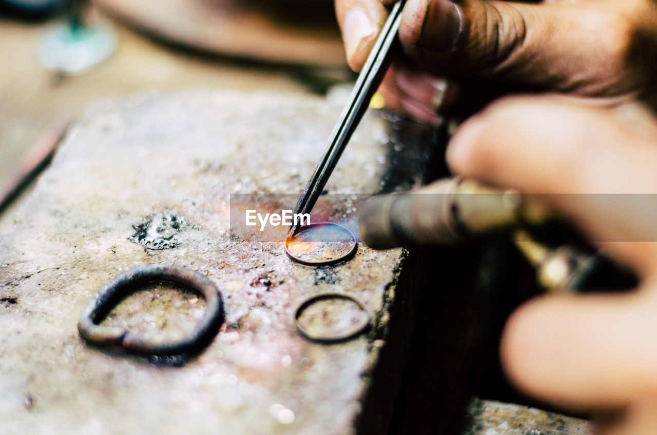 Close-up of person making ring