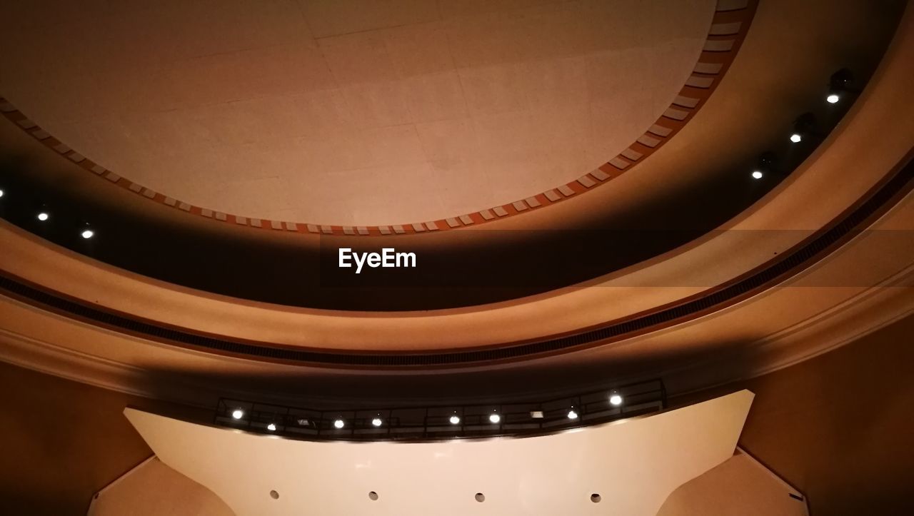 LOW ANGLE VIEW OF ILLUMINATED CEILING