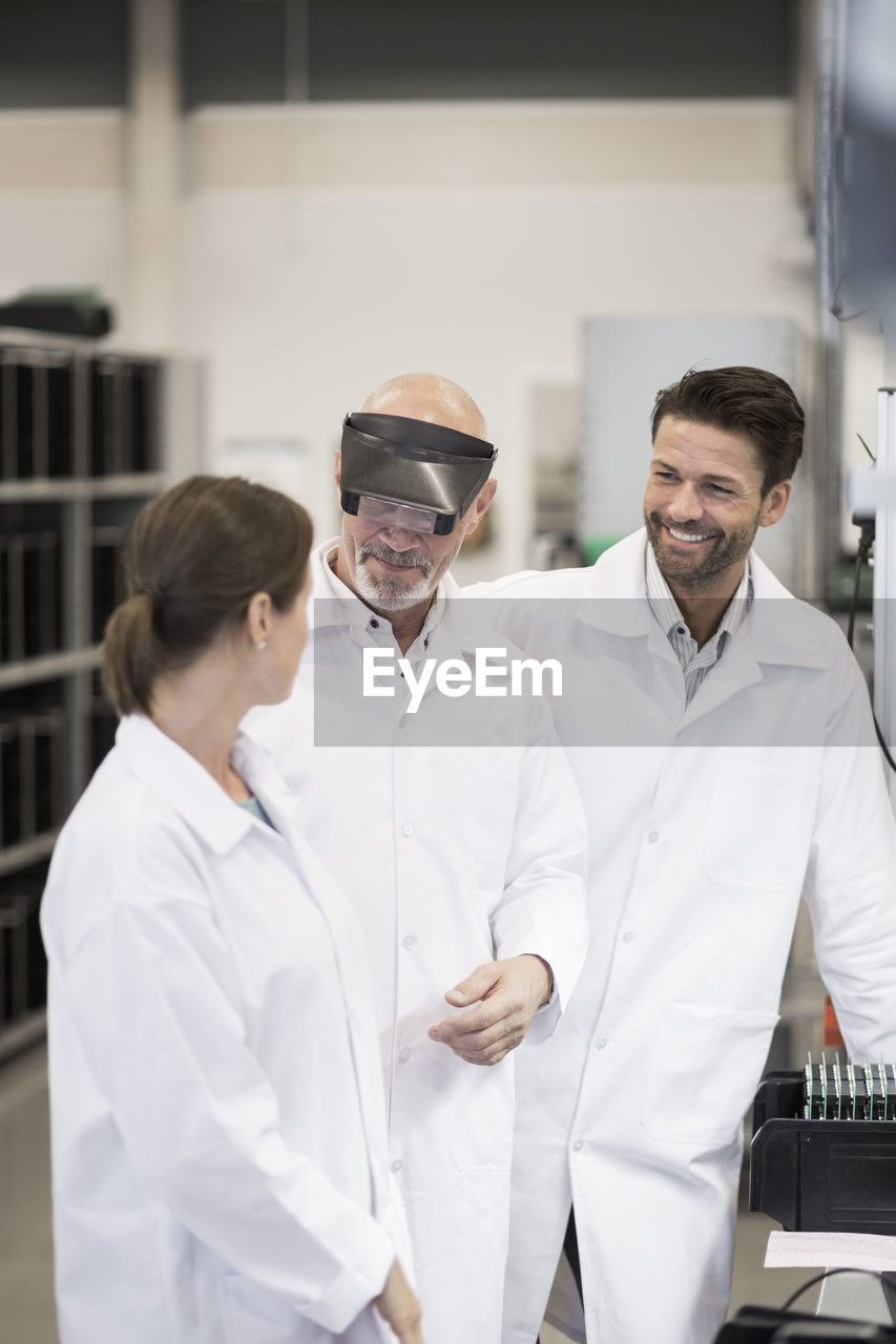 Team of engineers working in manufacturing plant