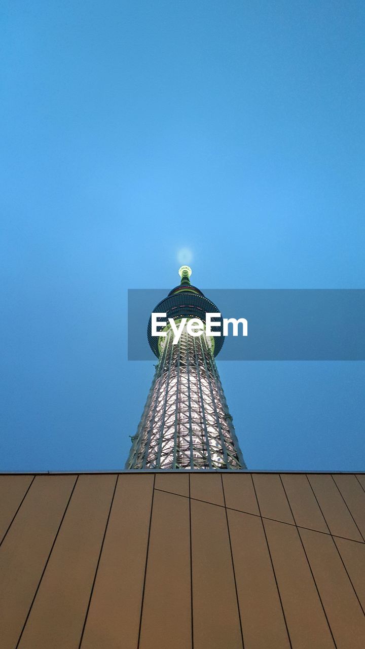 Low angle view of illuminated tokyo sky tree against clear sky at dusk