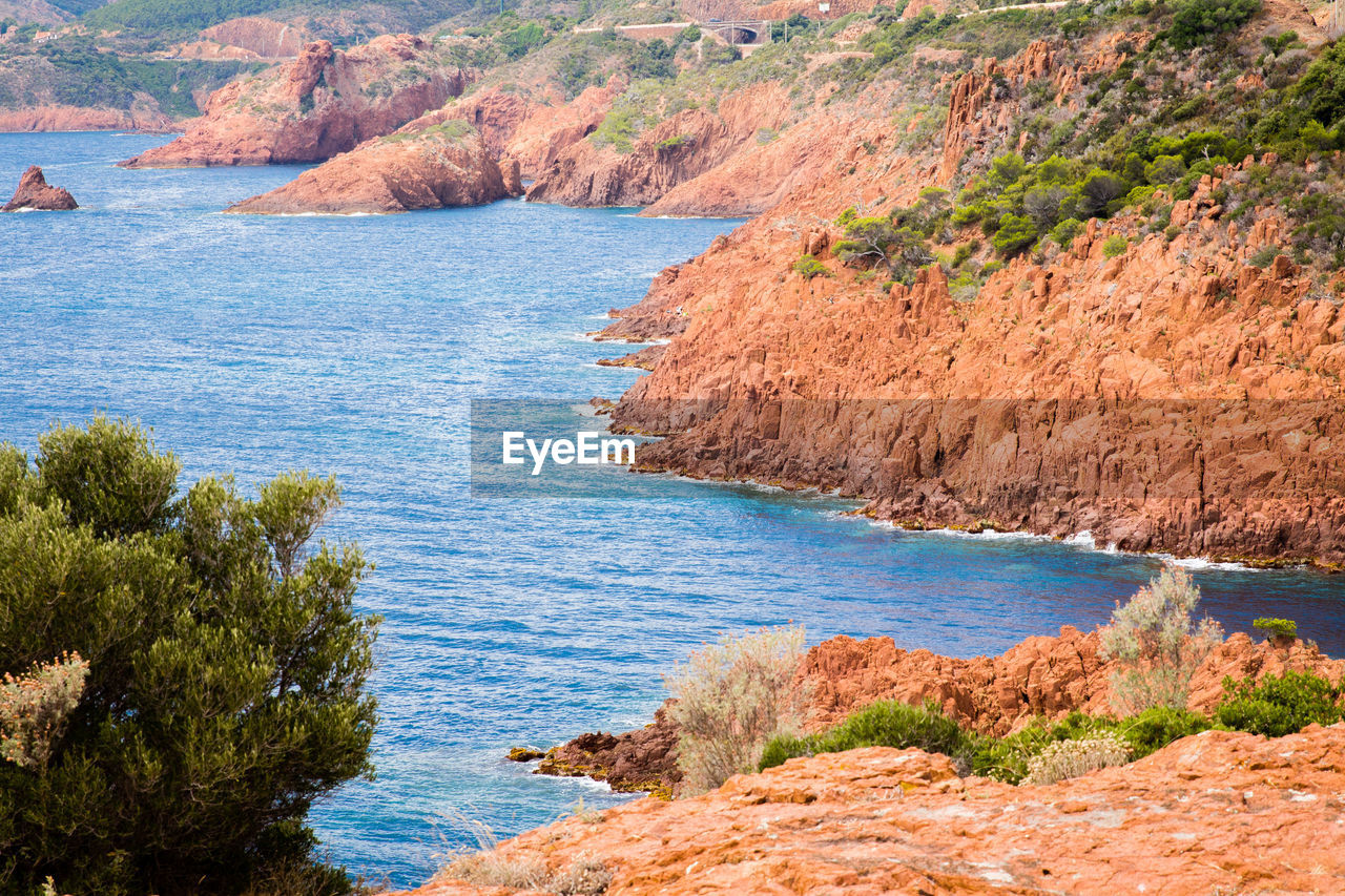 Scenic view of sea by cliff