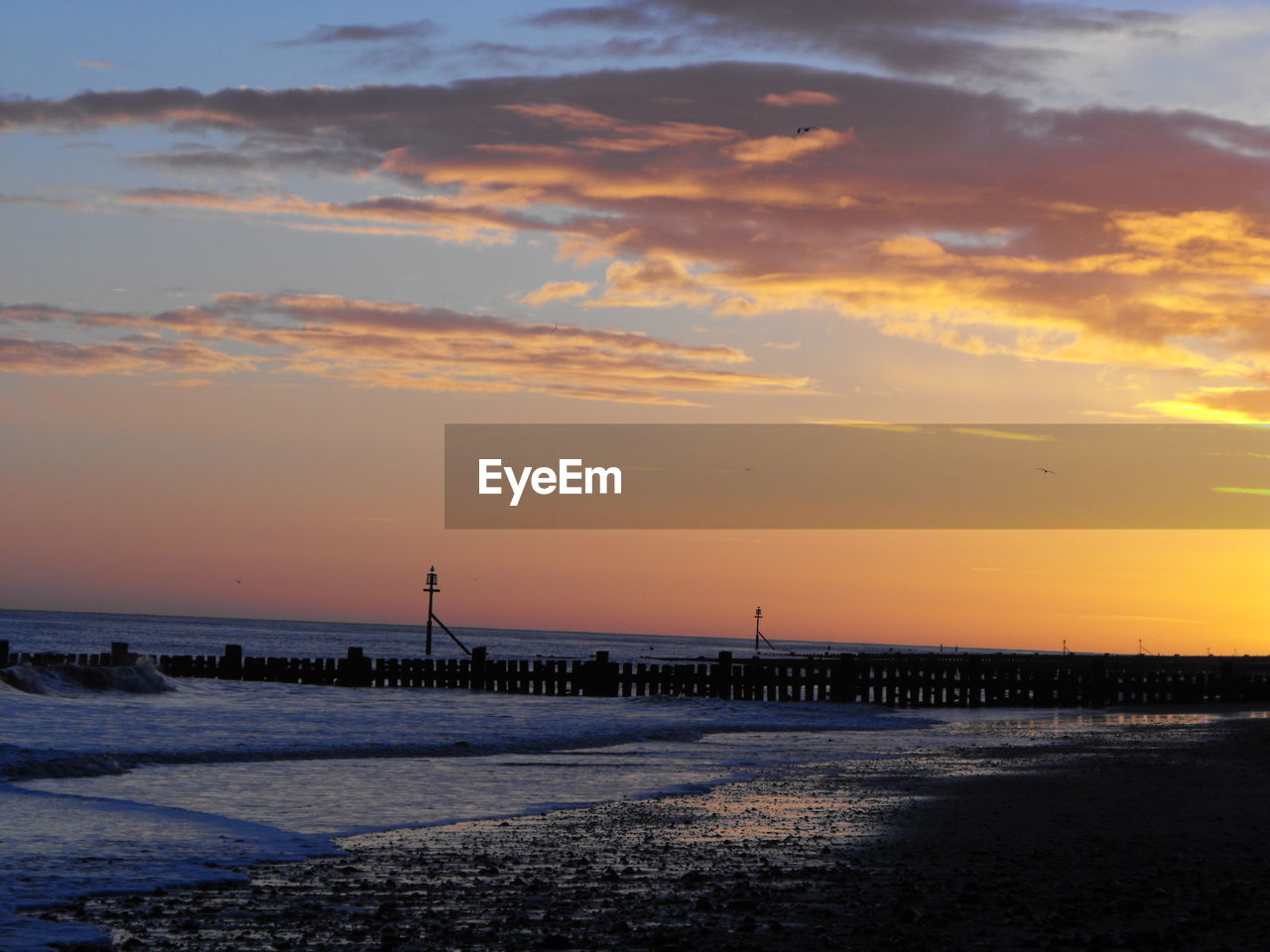 VIEW OF BEACH AT SUNSET