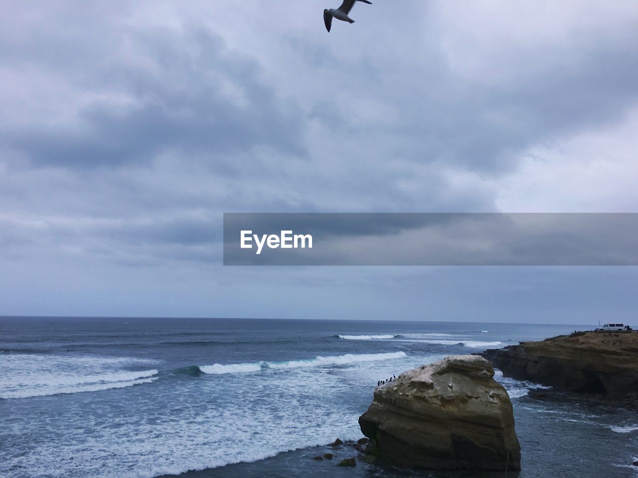 VIEW OF SEA AGAINST CLOUDY SKY