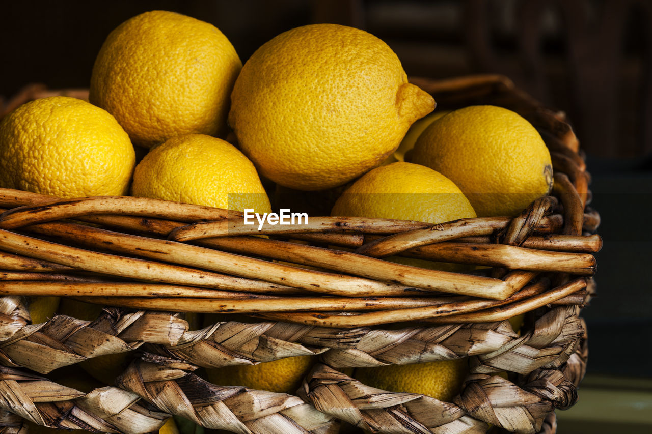 Close-up of lemons in wicker basket
