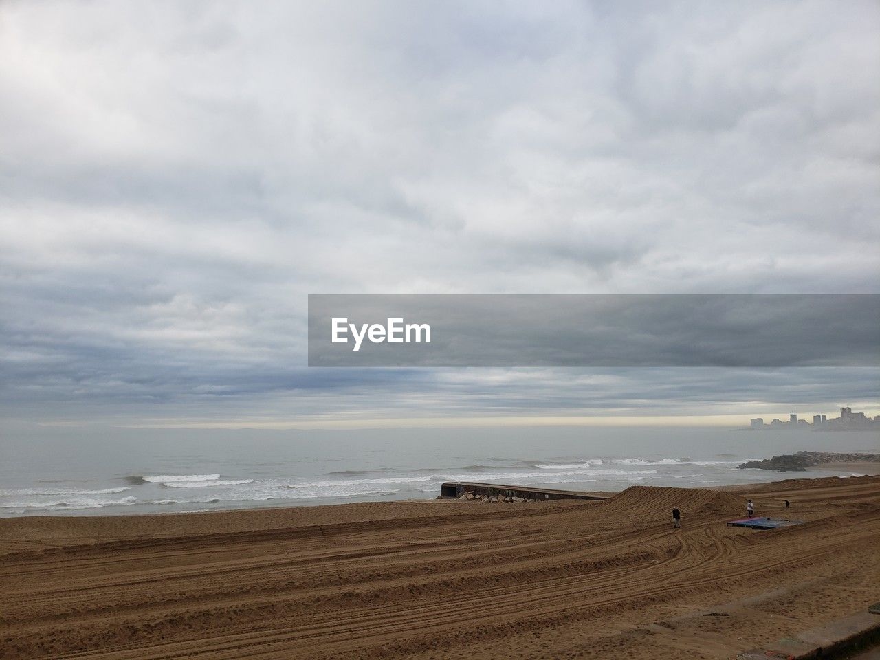 scenic view of beach against sky during sunset