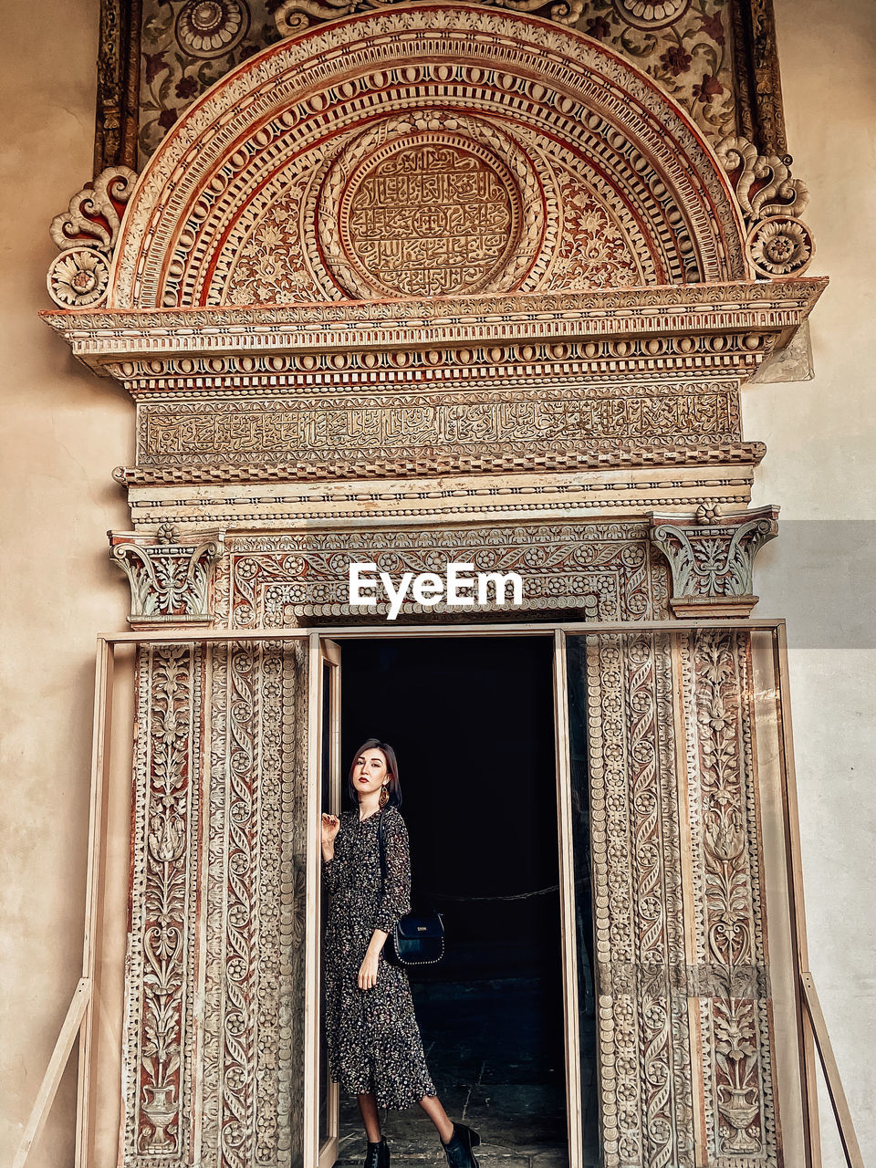 Woman standing in front of building